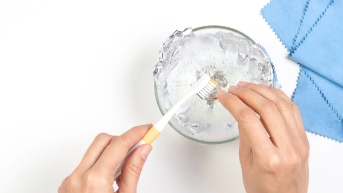cleaning with toothpaste brush