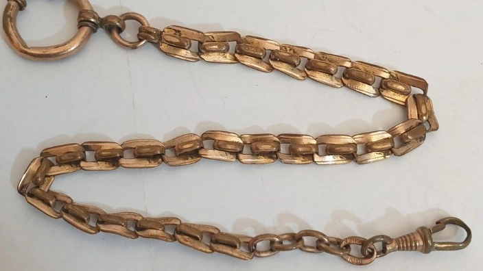 dirty gold chain needs cleaning