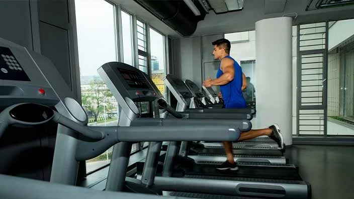 a man doing exercise on machines